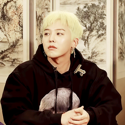 A Young Man With Blonde Hair Is Wearing A Black Sweatshirt GIF