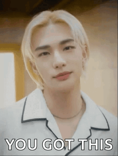 A Young Man With Blonde Hair Is Wearing A White Shirt And A Necklace And Says You Got This . GIF