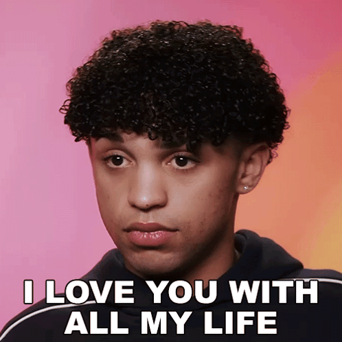 a young man with curly hair says i love you with all my life on a pink background