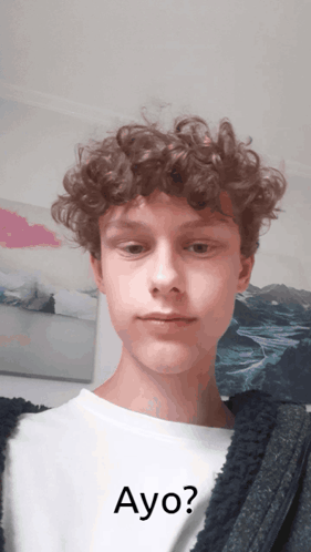 Young Man With Curly Hair Wearing Ayo Shirt GIF