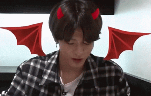A Young Man With Devil Horns And Wings On His Head GIF