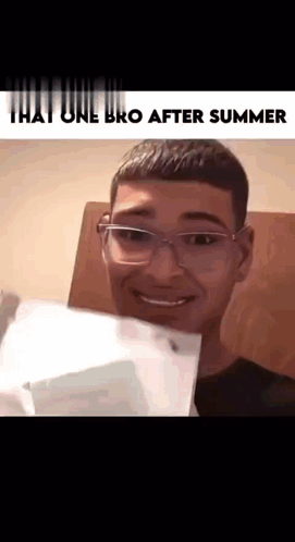 A Young Man With Glasses Is Smiling And Holding A Piece Of Paper . GIF