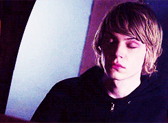A Young Man With His Eyes Closed Is Wearing A Black Jacket GIF