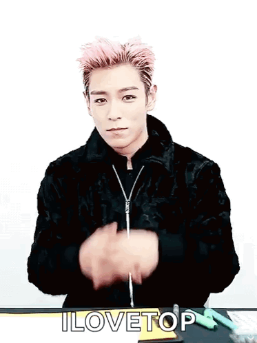 a young man with pink hair and a black jacket says i lovetop