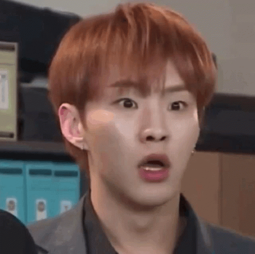 A Young Man With Red Hair Is Making A Funny Face . GIF
