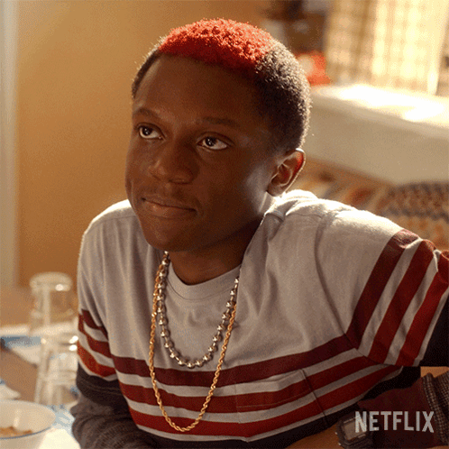 A Young Man With Red Hair Is Sitting At A Table With A Netflix Logo On The Bottom GIF