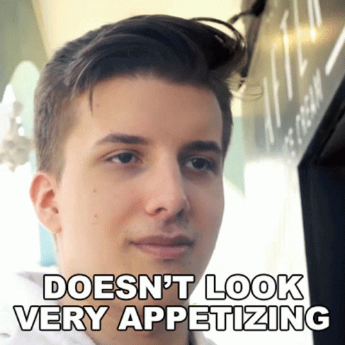A Young Man With The Words Does N't Look Very Appetizing Above His Face GIF