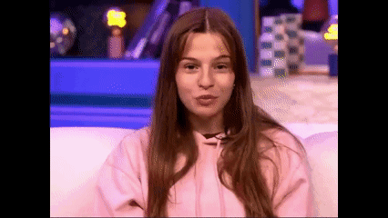 Woman Making Funny Face In Pink Hoodie GIF