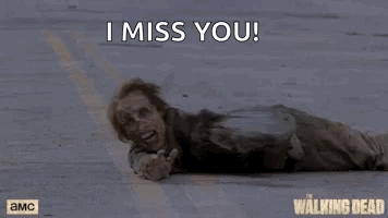 A Zombie Is Laying On The Ground With The Words `` I Miss You '' Written Above Him . GIF