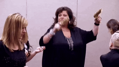 Abby Lee Miller Holding Two Guns GIF