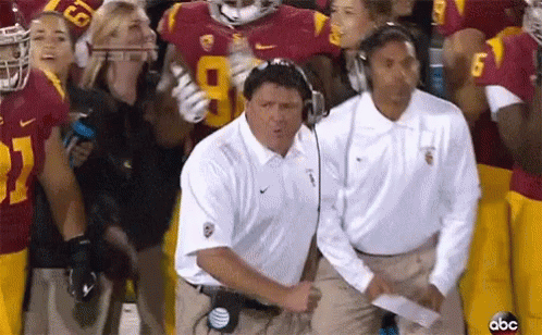 ABC Football Game Coach in White Nike Shirt
