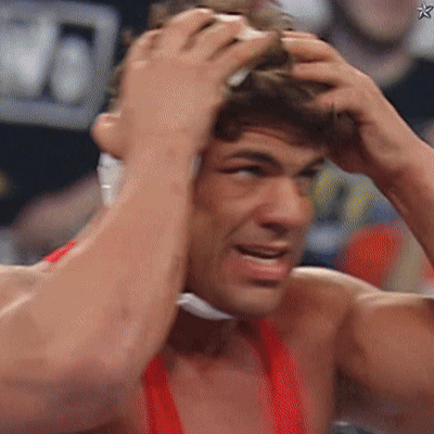 ACC Wrestler Next to Orange Tank Top Wrestler