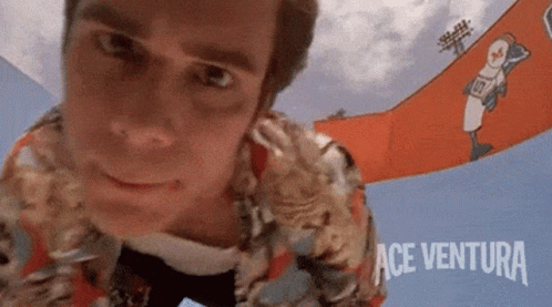 Ace Ventura Jim Carrey Face On Camera GIF