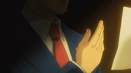 Ace Attorney Smiling Phoenix Wright Reading His Notes GIF