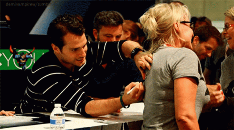 Actor Henry Cavill Signing Autograph GIF