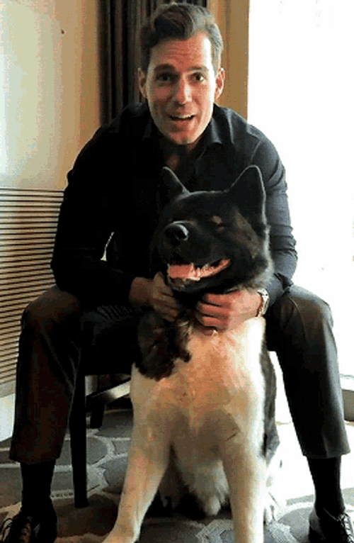 Actor Henry Cavill Sitting With Dog Kal GIF