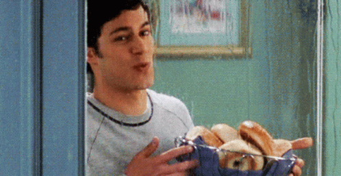 Adam Brody Carrying Basket Of Bagel GIF