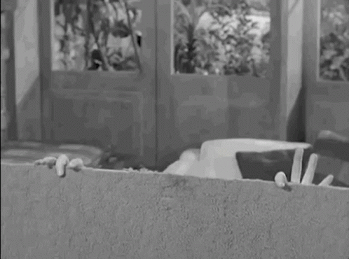 Addams Family Uncle Fester Howdy Funny Smile GIF