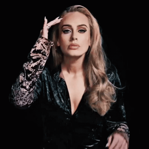 Adele Fixing Her Temples And Hair GIF
