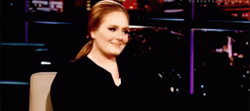 Adele Hello Looks To The Right Smiling GIF