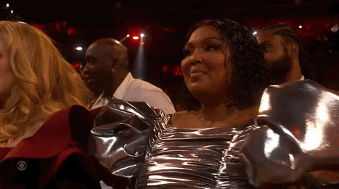 Adele Passes In Front Of Lizzo GIF