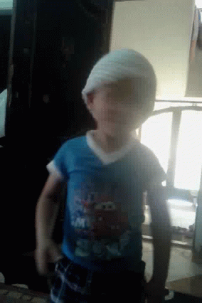 Adorable Kid Shaking Head No GIF