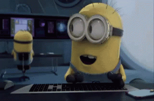 Adorable Minions Pretending To Work GIF