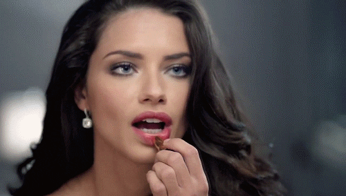 Adriana Lima Using Lipstick GIF