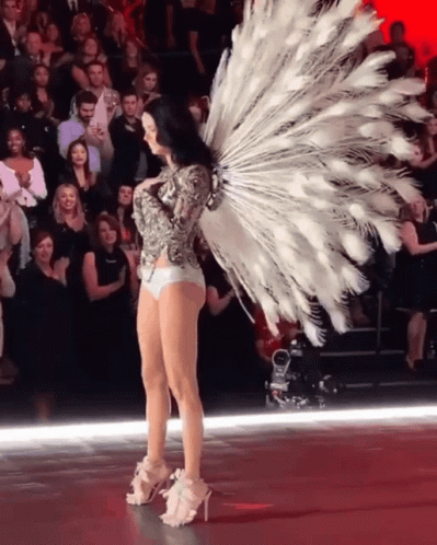 Adriana Lima Using Peacock Feathers GIF