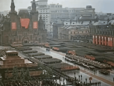 Aerial City With Buildings And People GIF