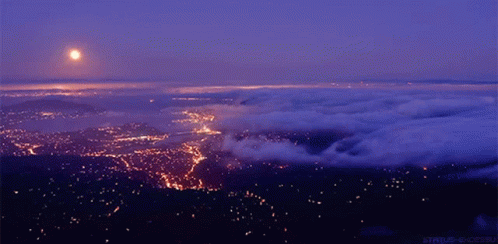 Aerial View City at Night With Full Moon