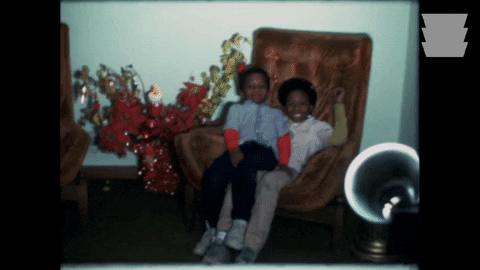 African American Christmas For Kids On Couch GIF