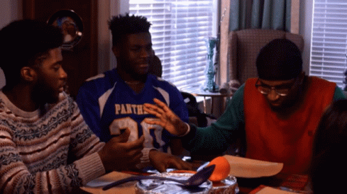 African American Christmas Guy Opening Food GIF