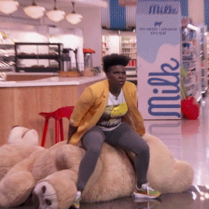 African Lady Nap On Big Stuff Toys GIF