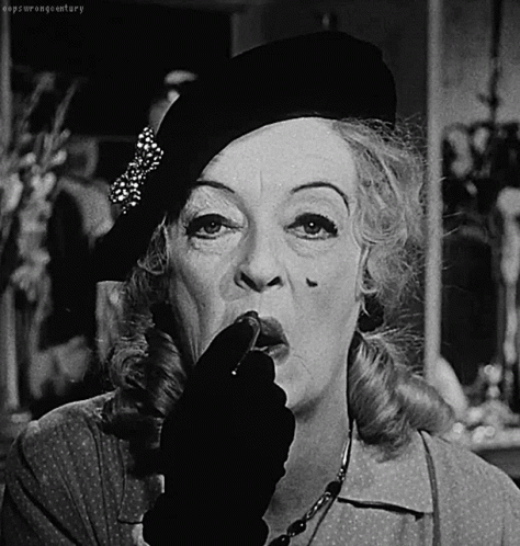 Aging Bette Davis Putting Lipstick GIF