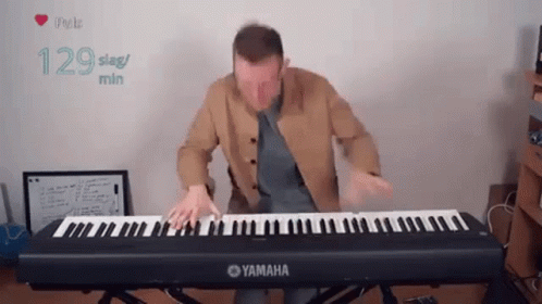 Akmigone Playing Piano GIF