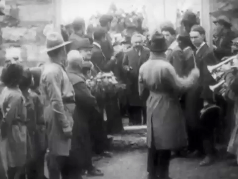 Albert Einstein Enters And Holds Flower GIF