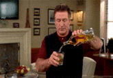 Alec Baldwin Pouring Drink GIF