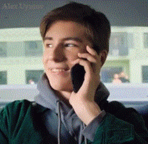 Alex Talking Happily On Best Smartphone GIF