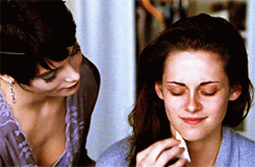 Alice Cullen Puts Make Up On Bella Swan GIF