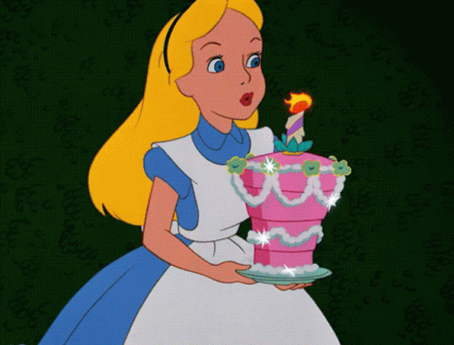 Alice From Alice In Wonderland Blows Out A Candle On A Pink Cake GIF