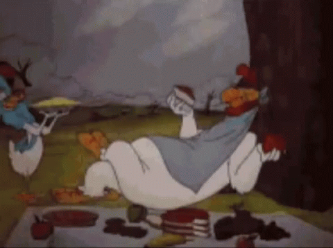 Alice in Wonderland Lying on Back on Picnic Blanket