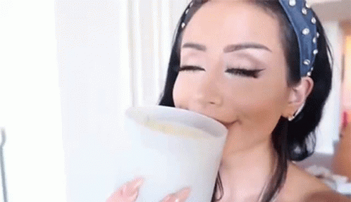 Amber Scholl Fascinated Sniffing Candle GIF