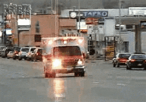 Ambulance Rushing On The Highway GIF