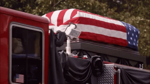 American Flag Draped Over Coffin