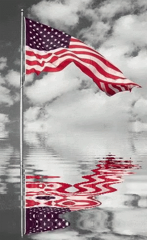 American Flag Reflected in Water With Clouds