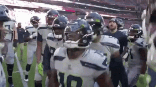American Football Players Walking Off Field GIF