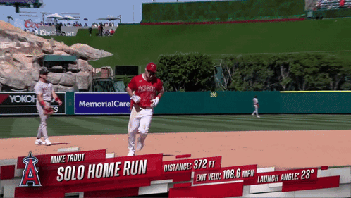 An Ad For Mike Trout 'S Solo Home Run Is Displayed On A Baseball Field GIF
