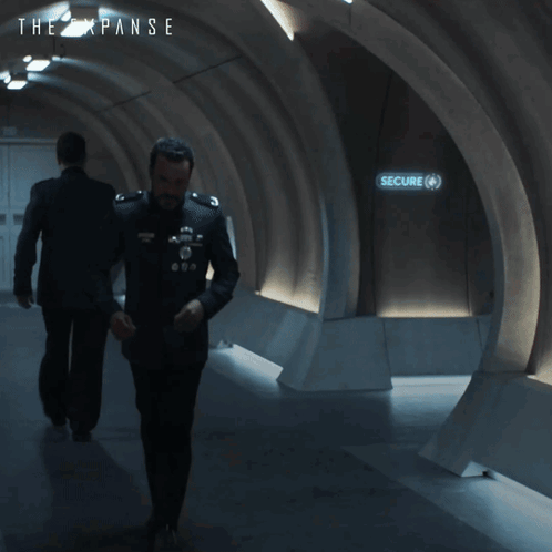An Ad For The Expanse Shows A Man And A Woman GIF