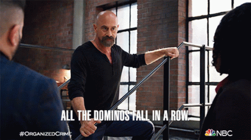 An Advertisement For Organized Crime Shows A Man Holding A Railing And Says All The Dominoes Fall In A Row GIF